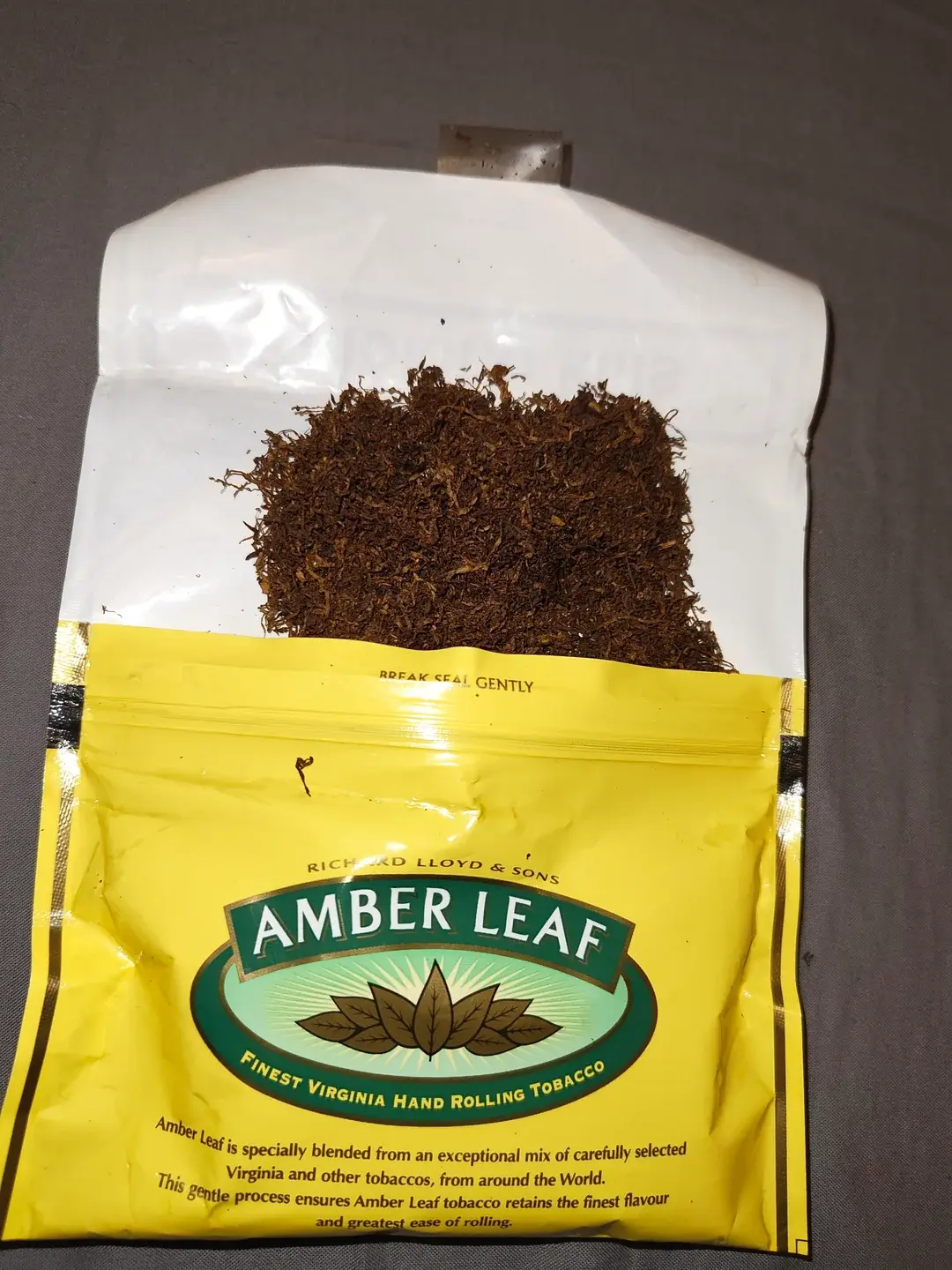 Opened pouch with fresh tobacco close-up