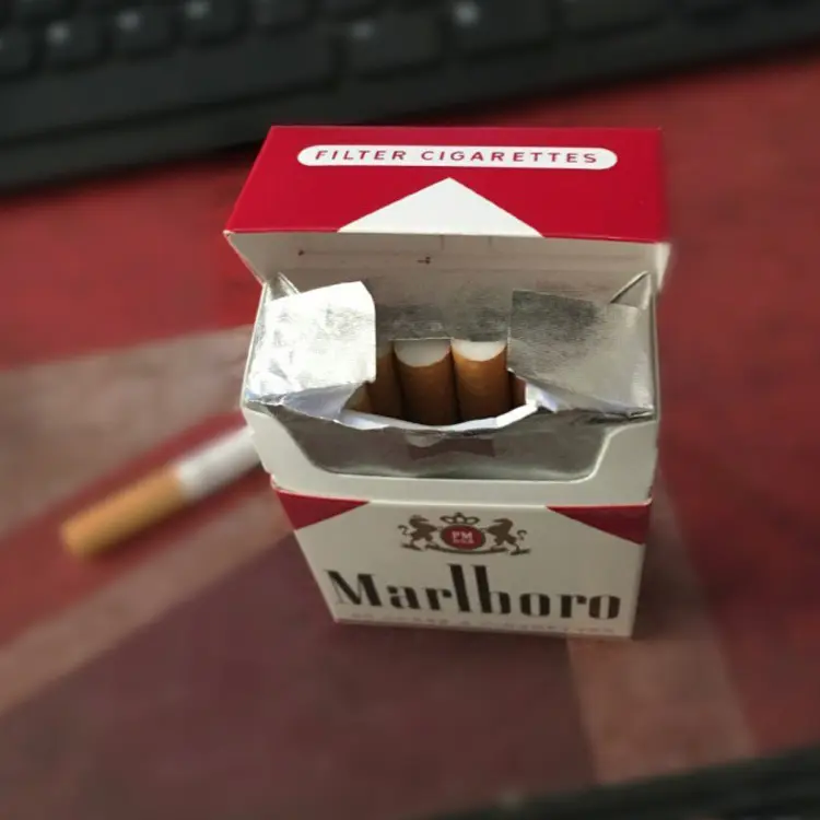 Opened pouch with fresh tobacco close-up